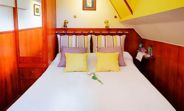 Guest room on board luxury French barge hotel